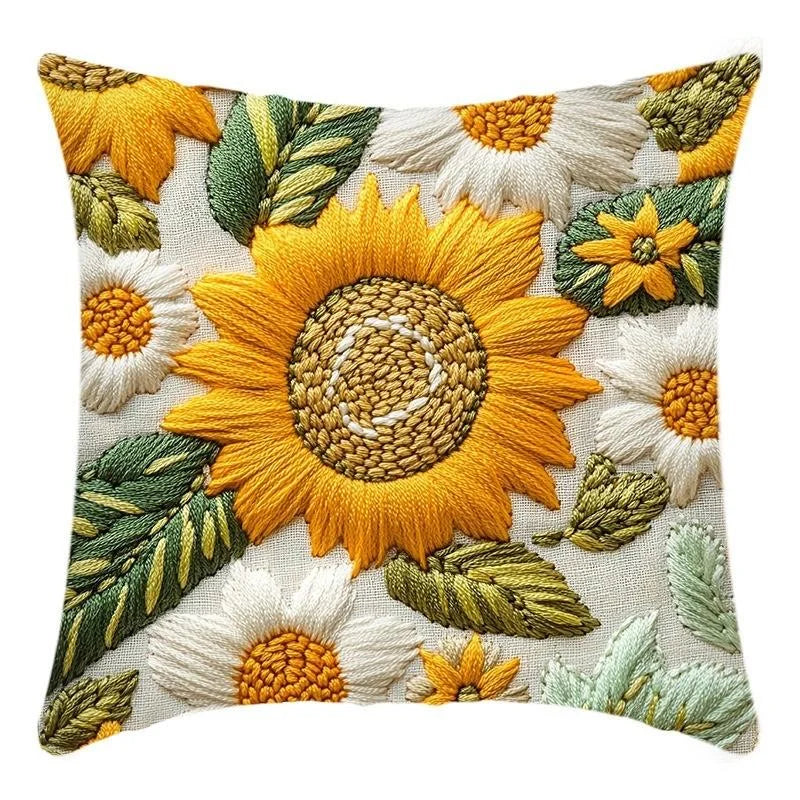A decorative cushion cover featuring various shades of yellow and green sunflower patterns.