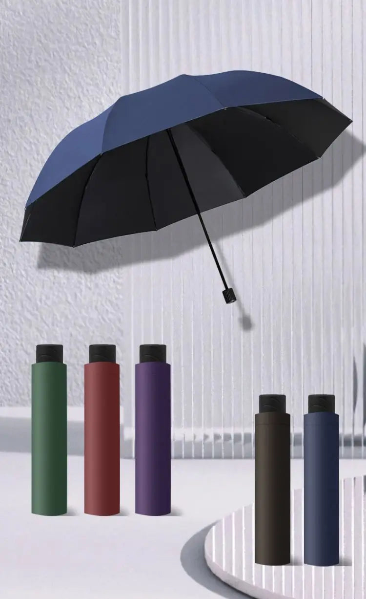 A collection of five windproof folding umbrellas in various colors, including black, dark green, maroon, purple, and navy blu