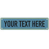 A rectangular teal metal sign with a gold border and the text YOUR TEXT HERE in white capital letters.