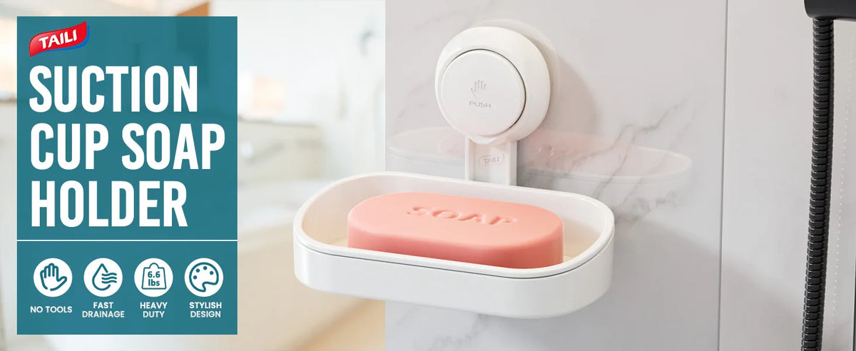A white suction cup soap holder with a pink removable tray mounted on a wall.