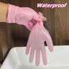 A hand wearing a pink waterproof disposable glove is shown above a white sink.