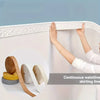Hands are applying a continuous wallline skirting trim sticker to a white wall border.