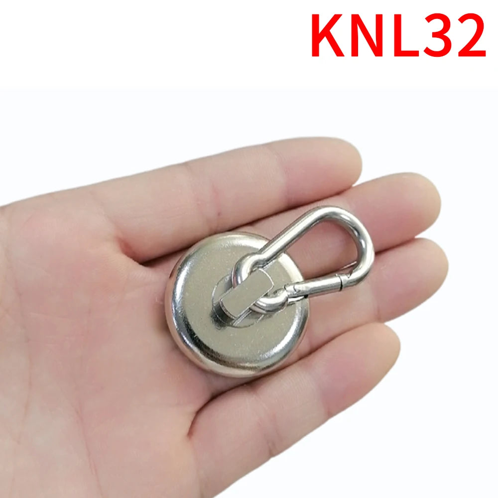 A hand holds a heavy duty neodymium magnetic hook with a swivel carabiner.