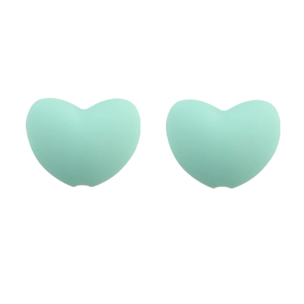 A pair of light mint green silicone heart beads for DIY jewelry making