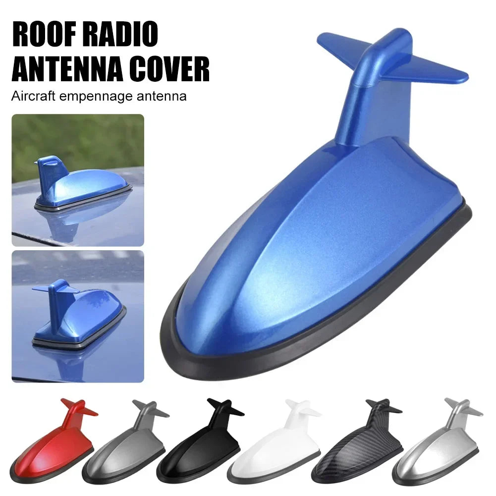 A collection of various aerodynamic antenna covers and boosters in red, black, silver, and white finishes.