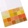 A plastic box filled with various colors of glass rice beads for jewelry making