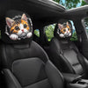 A pair of cat-themed headrest covers featuring cute feline faces placed in a car interior.