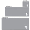 A set of oversized non-slip desk mats in gray, showing different sizes and a white mouse icon.