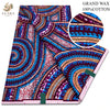 A close-up view of a vibrant purple and pink African wax print fabric with swirling patterns.