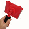 A hand is holding a red paint edge trimmer with a black handle and a rotating head.