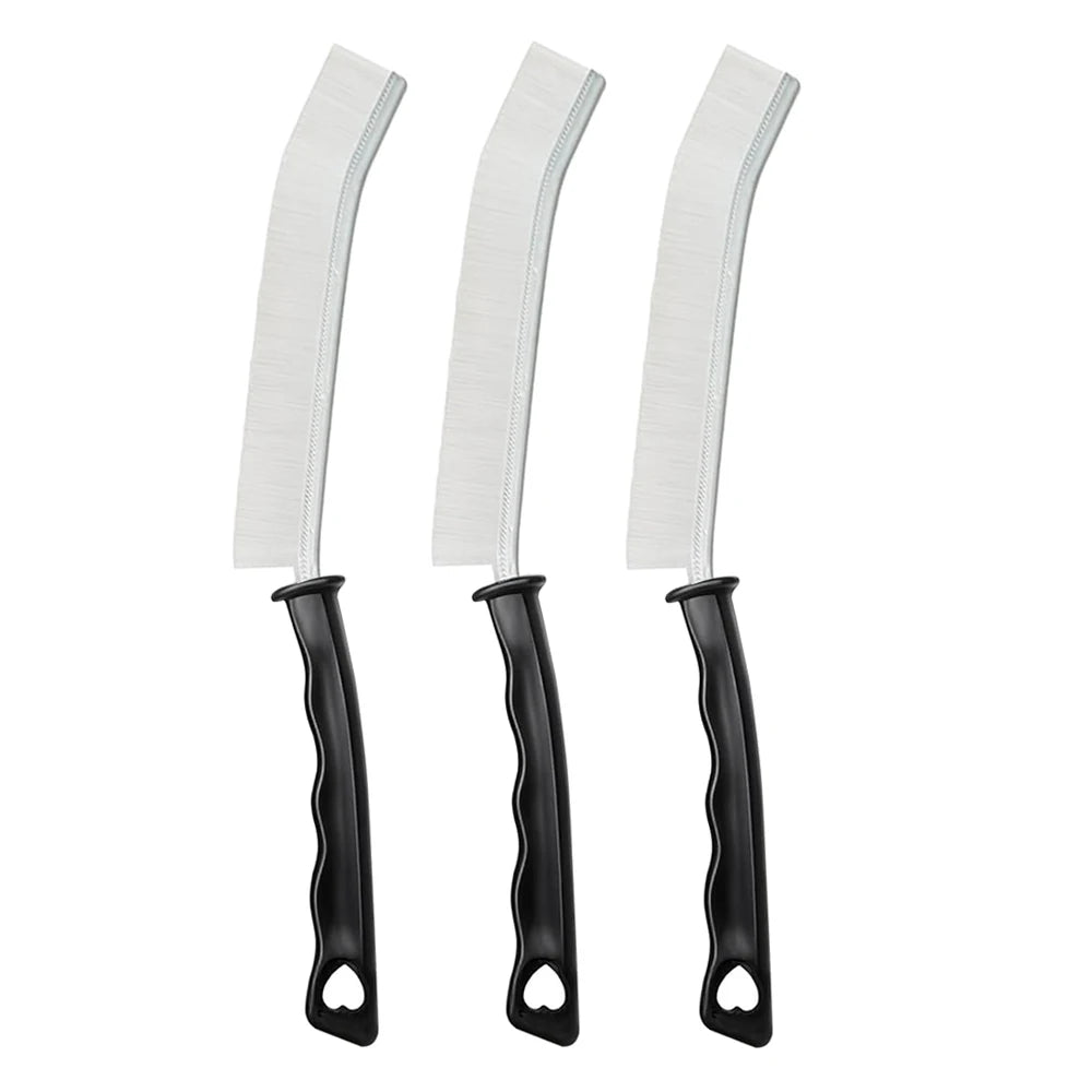 A set of white crevice cleaning brushes with black handles.