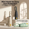 A mini hook designed for easy sun protection, shown next to a compact folding umbrella.
