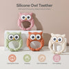 A set of silicone owl teethers in pink, orange, and cream colors shown against a white background.