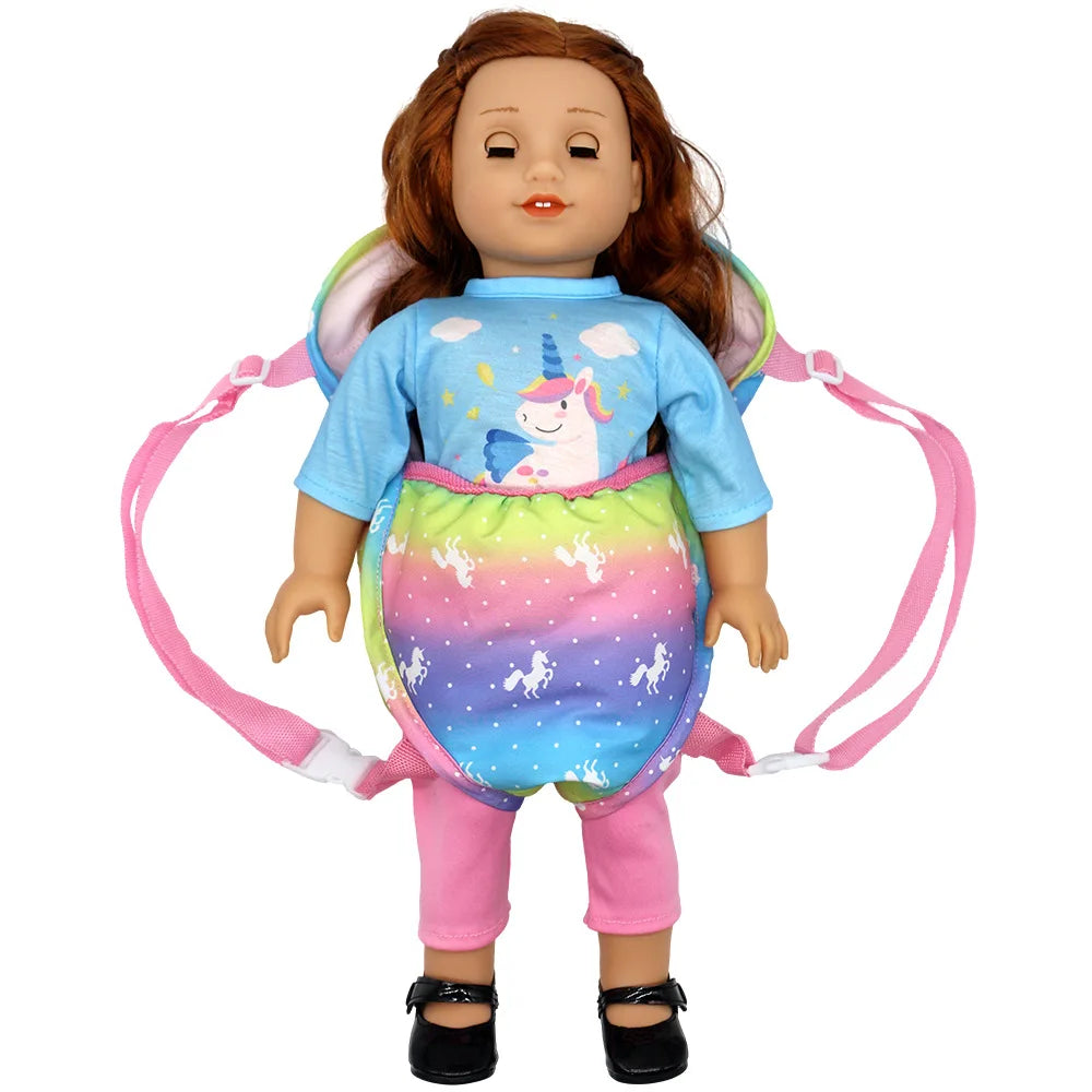 A doll carrier backpack with adjustable pink straps and a doll wearing a unicorn shirt.