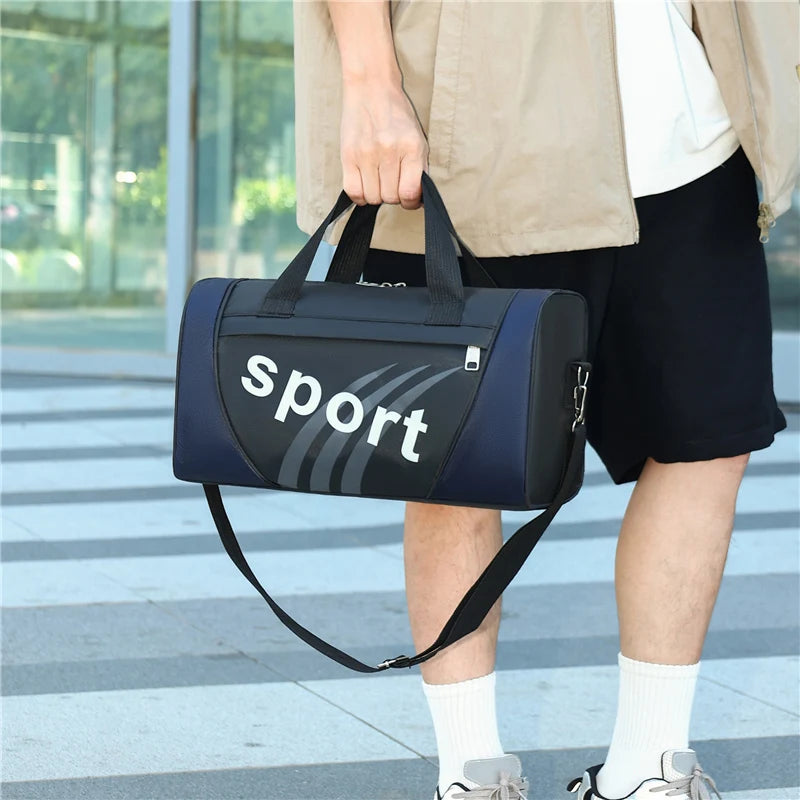 A person is holding a dark blue duffel bag with a white 'sport' logo, standing outdoors.