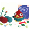 A DIY crochet kit featuring a red and yellow animal figure, yarn, and tools for making cute projects.