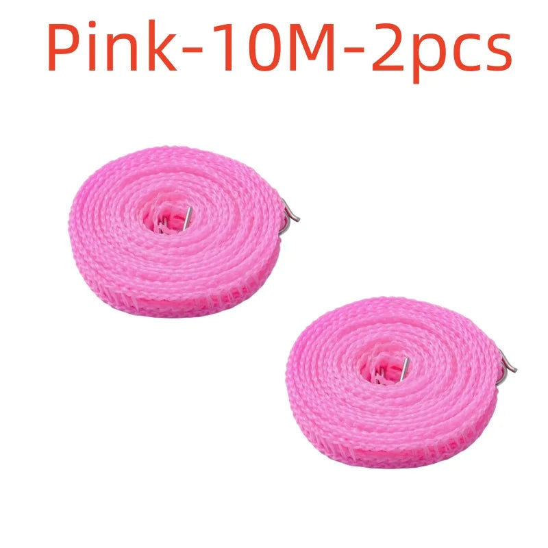 Dos tendederos de nylon rosas de 10 metros enrollados para secado al aire libre