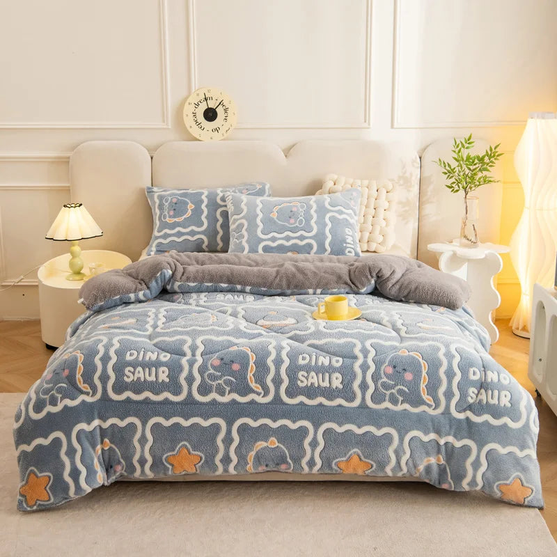 A blue and white patterned plush throw blanket is displayed on a bed, featuring dinosaur designs.