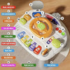 A white baby interactive activity table featuring various buttons, a steering wheel, and a musical piano key.