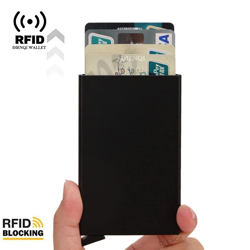 A black slim metal RFID blocking card holder with a pop-up design displaying several cards.