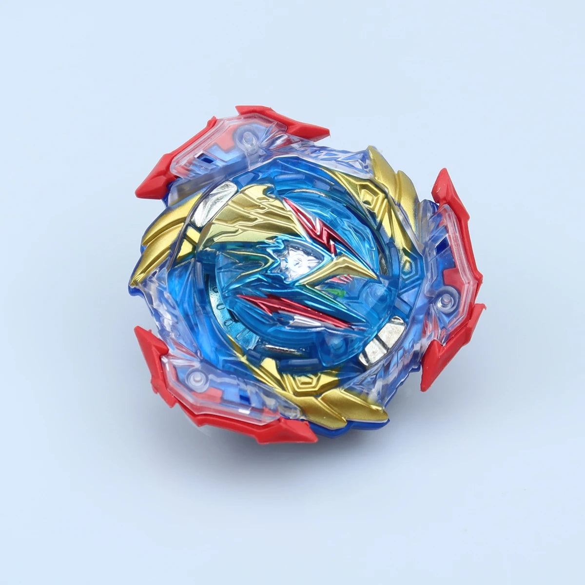 A clear and red metal battle spinning top featuring gold accents and a blue swirling design.