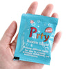 A hand holds a packet of Party Bubble liquid, a 3+ ages product.