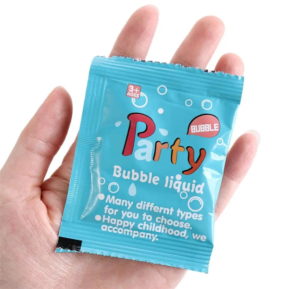 A hand holds a packet of Party Bubble liquid, a 3+ ages product.