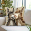 A decorative pillow featuring a realistic cartoon depiction of two adorable donkeys.
