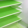 Three stacked bright green EVA refrigerator shelf liners with white edges.