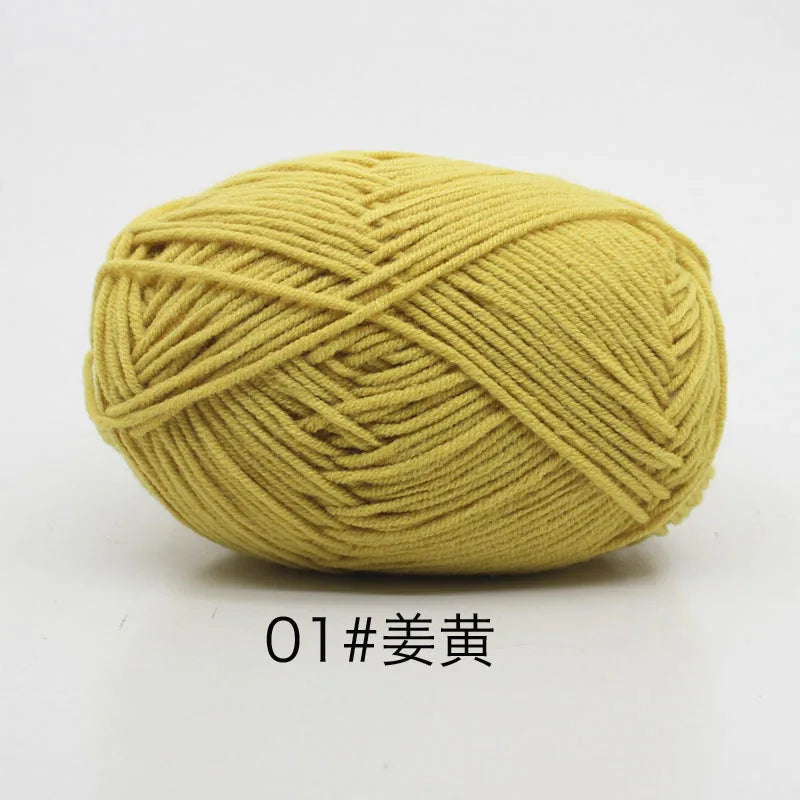 A ball of soft yellow milk cotton yarn for knitting and crochet