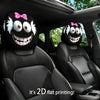 Two black car headrest covers featuring cartoon faces with pink bows and white fur accents