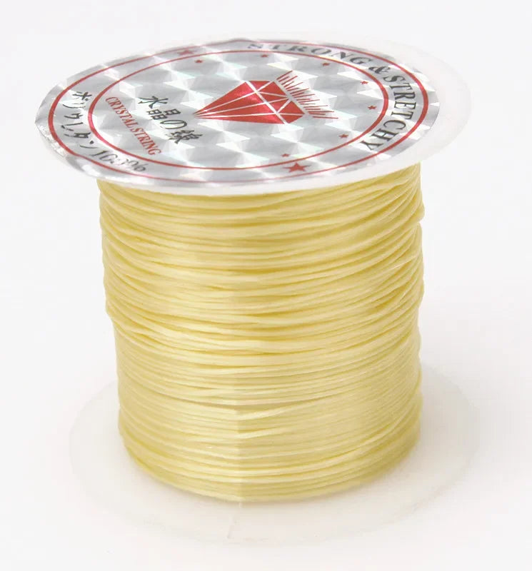 A spool of 10m multicolour elastic cord for beading and jewelry making with a decorative label.