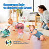 A baby is interacting with a pink jellyfish toy that features LED lights and an omni-directional wheel for exploration.
