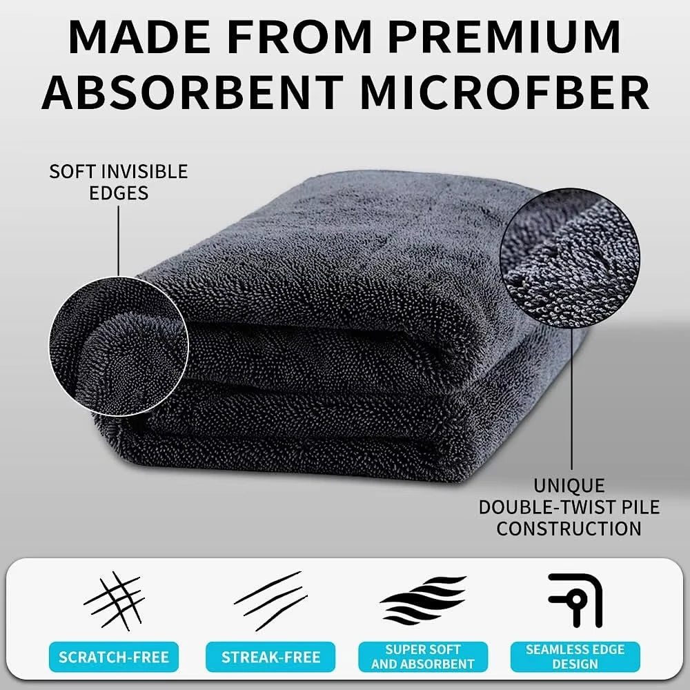A stack of dark gray microfiber drying towels with a scratch-free, streak-free design.