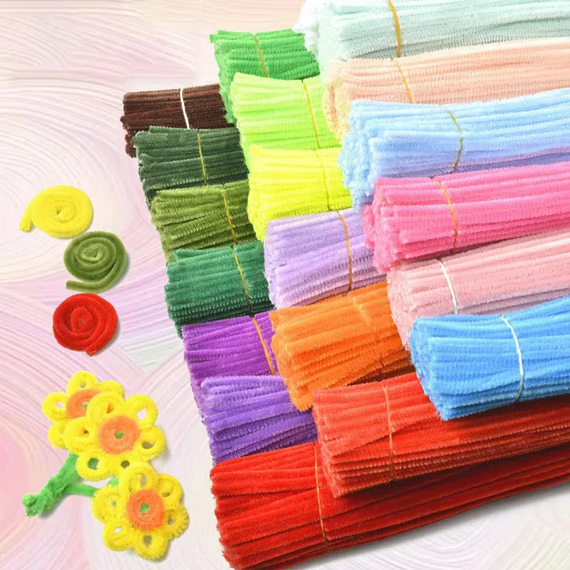 A collection of colorful chenille craft stems in various shades of green, yellow, pink, purple, and blue.