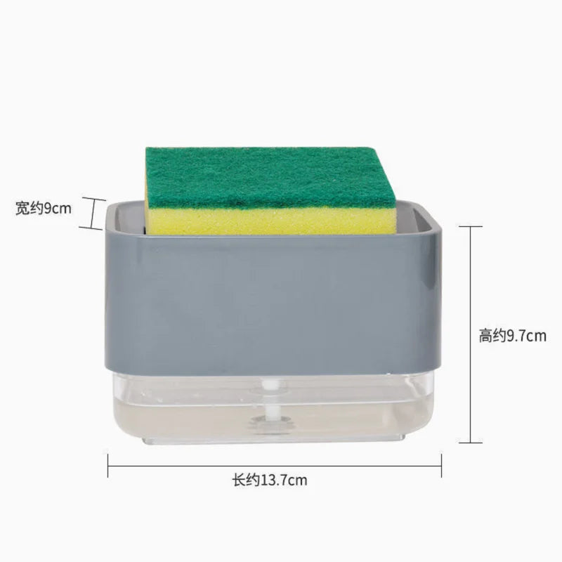 A gray kitchen soap dispenser with a clear base and a green sponge holder.