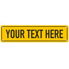 A yellow rectangular sign with black text that says YOUR TEXT HERE.