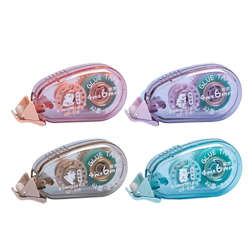 Three rolls of double-sided adhesive tape in pink, purple, and blue packaging for crafts and office use