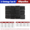 A box of black heat shrink tubing kit containing various sizes and lengths for shrinking pipes.