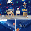 Blue universe pattern peel and stick wallpaper featuring planets and stars on a wall.