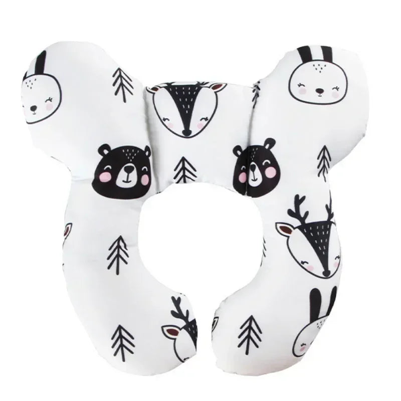 White baby car seat head and neck support pillow with animal designs and safety straps