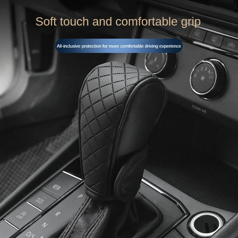A close-up of a black PU leather gear shift cover with a textured grip resting on a car console.