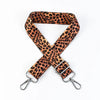 A leopard print wide adjustable crossbody bag strap in brown and black spots.