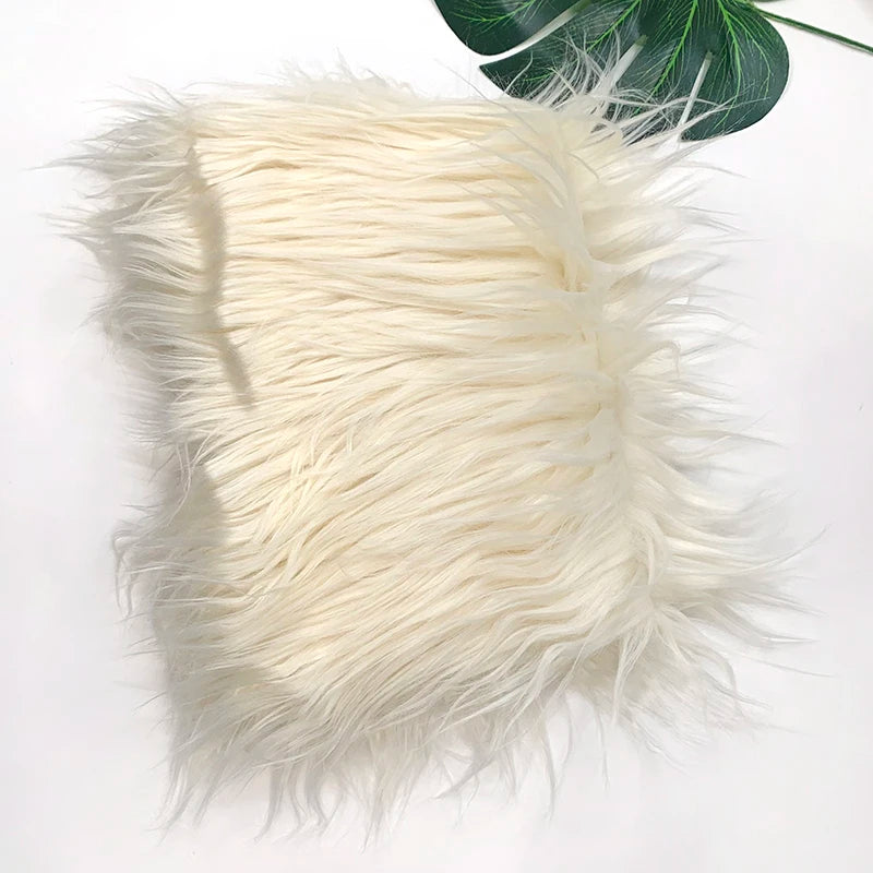 A swatch of soft, cream-colored faux fur fabric used for DIY sewing and cosplay.