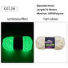 A spool of bright green luminous polyester yarn labeled DTY GLOW CHENILLE for knitting and crochet.