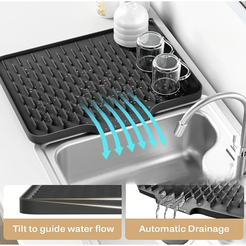 Silicone dish drying mat with automatic drainage features shown in a kitchen sink.