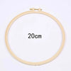 A circular embroidery hoop with a 20cm diameter, used for floral cross stitch embroidery.