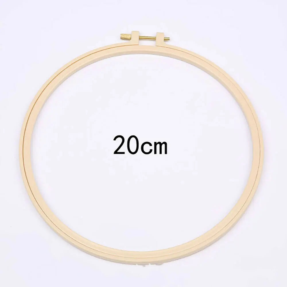 A circular embroidery hoop with a 20cm diameter, used for floral cross stitch embroidery.