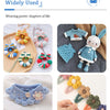 A collection of crochet hooks featuring a blue bee design in various sizes and colors.