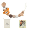 Wooden pacifier clip with a chain of crochet beads and a linen pouch for baby teething
